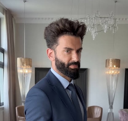 Andy Azadzoi portrait in a formal navy suit